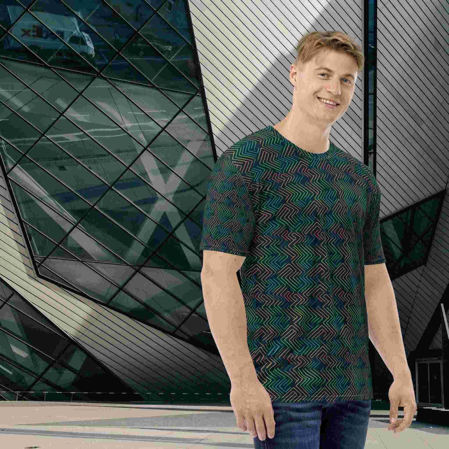 Cool T shirt design featuring a dark green neon pattern, which is geekish yet athletic and confident, worn by a man standing in front of a modern and futuristic building.