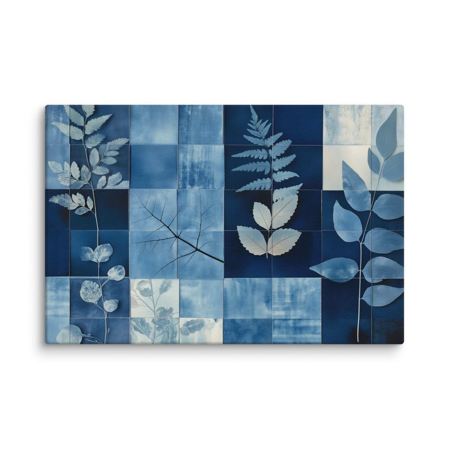 Discover PHOTOTYPE, a serene yet striking large landscape canvas print featuring a botanical cyanotype collage. Intricate white leaf silhouettes dance against rich indigo and navy blues in a modern grid design. Experience the beauty of nature and scientific artistry. Perfect for adding a touch of sophisticated calm to any space. This canvas print has a vivid, fade-resistant print that you're bound to fall in love with. 32x48 inch dimensio. Landscapre orientation. White background.