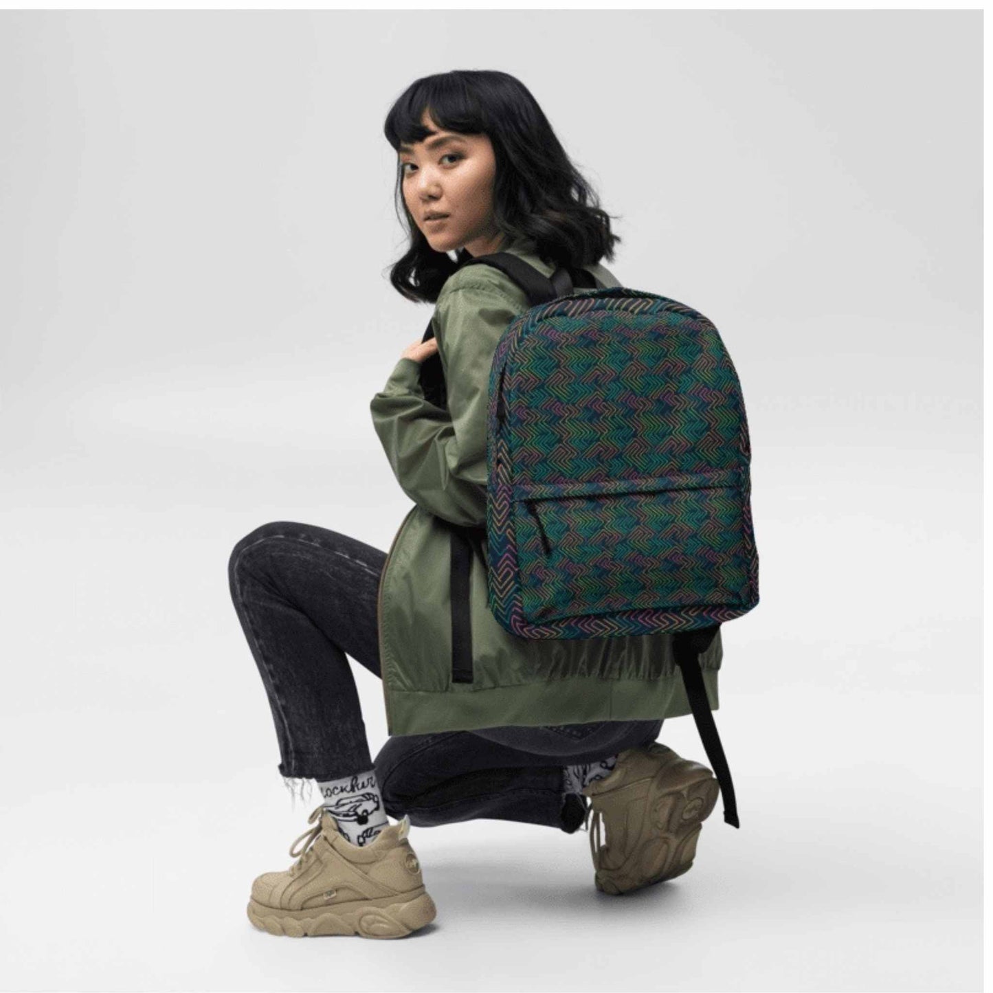 Printed backpack on a girl, featuring a dark neon electrical circuit design.