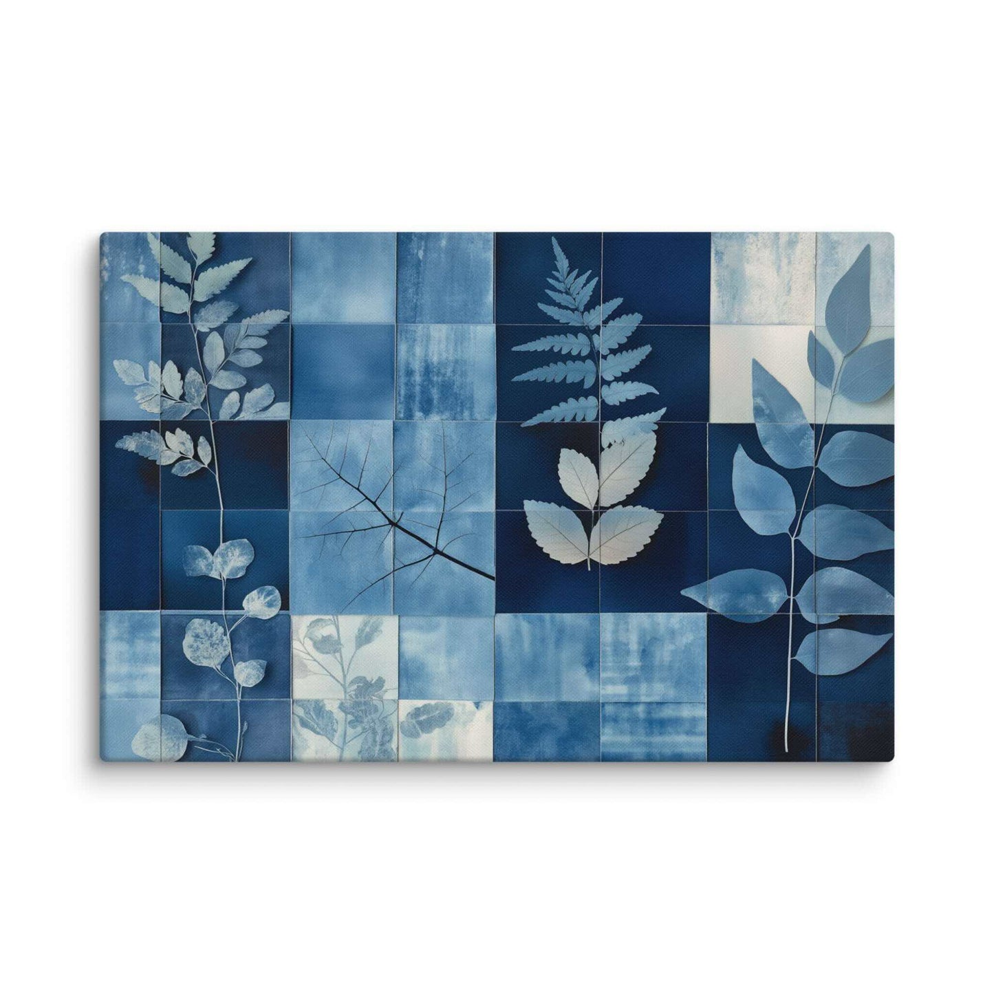 Discover PHOTOTYPE, a serene yet striking large landscape canvas print featuring a botanical cyanotype collage. Intricate white leaf silhouettes dance against rich indigo and navy blues in a modern grid design. Experience the beauty of nature and scientific artistry. Perfect for adding a touch of sophisticated calm to any space. This canvas print has a vivid, fade-resistant print that you're bound to fall in love with. 40x60 inch dimensio. Landscapre orientation. White background.