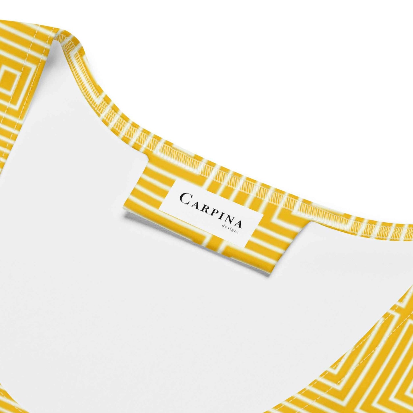Yellow and white bodycon dress with a "Carpina Designs" label.