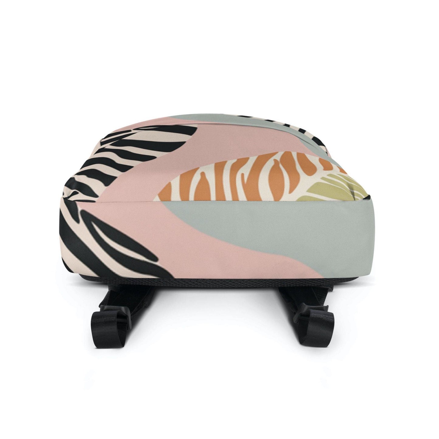 A zebra print backpack, showing the bottom view.