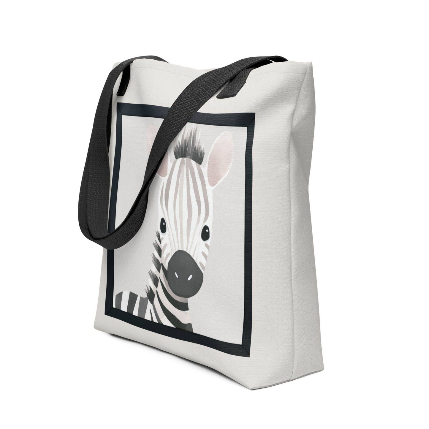 Cute totes with watercolor illustration that captures the sweet, gentle innocence of a baby zebra with soft taupe and cream stripes, topped with an irresistibly spiky mane. Black handles. Dimensions 15x15 inches. Side view. White background.