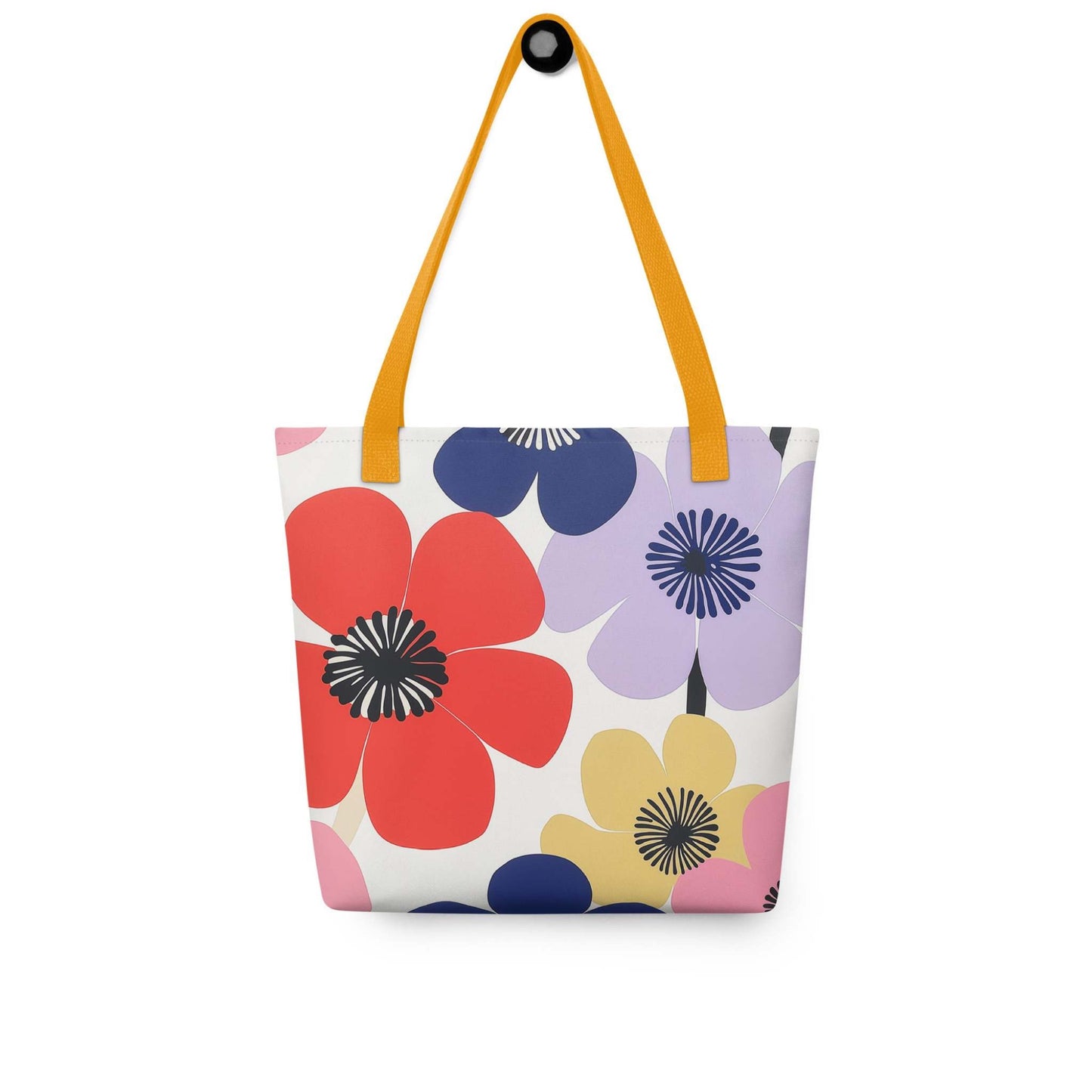 A Floral Tote Bag, with yellow handles, which features a stunning, abstract bloom pattern that brings warmth and joy wherever you go.The bag hangs on a wall. White background.