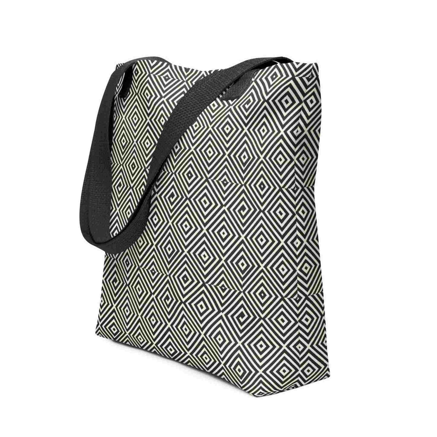 A diamond pattern tote bag with black handles, which features a mesmerizing black and whitegeometric look. White background