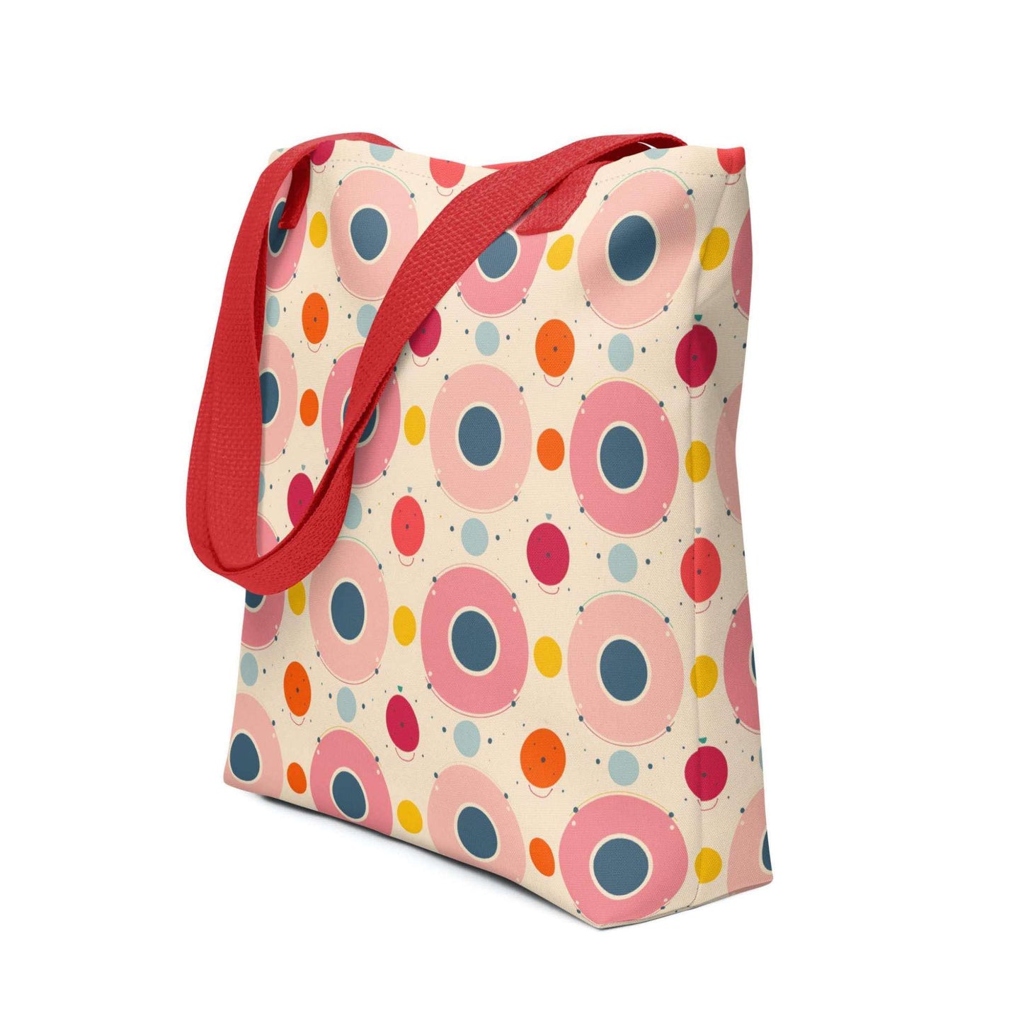 Artsy tote bag with red handles, which features an artsy design of pastel candy pops of color in a beige background, shown in side view. Dimension 15x15 inches. White background.