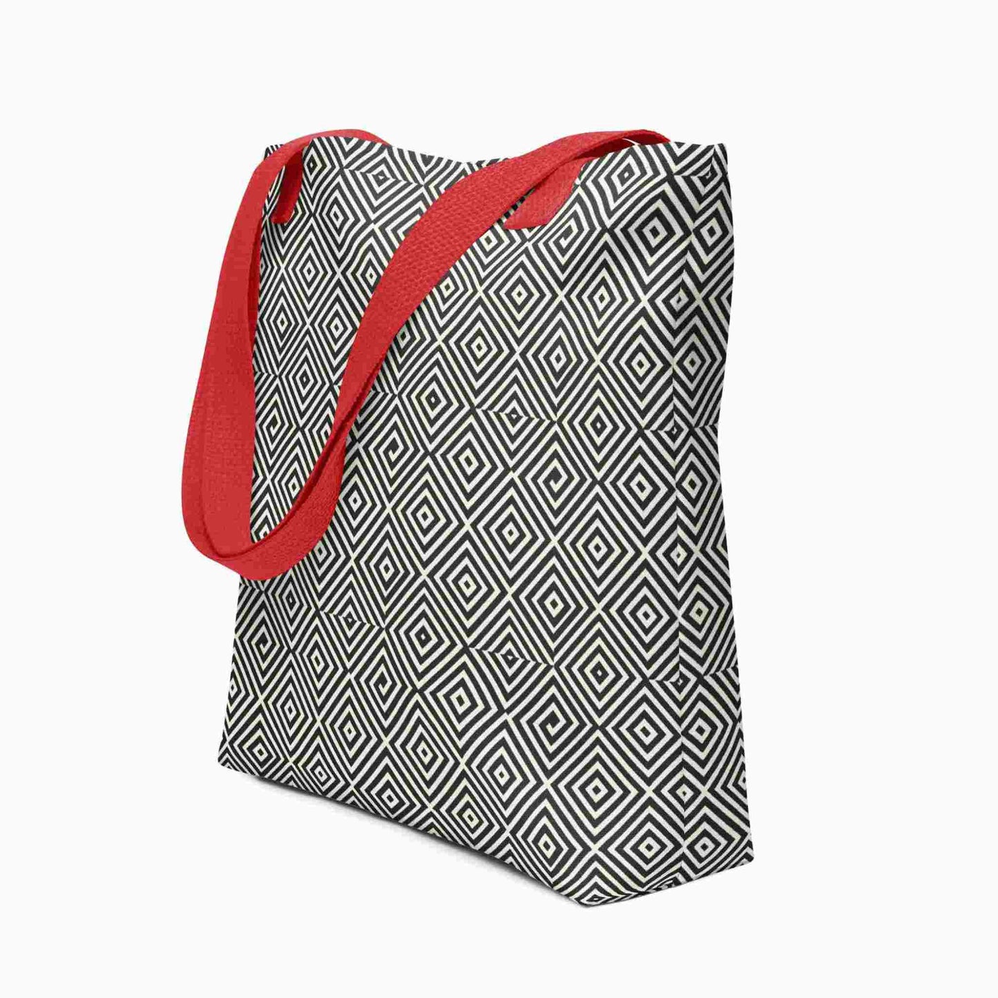 A diamond pattern tote bag with red handles, which features a mesmerizing black and whitegeometric look. White background
