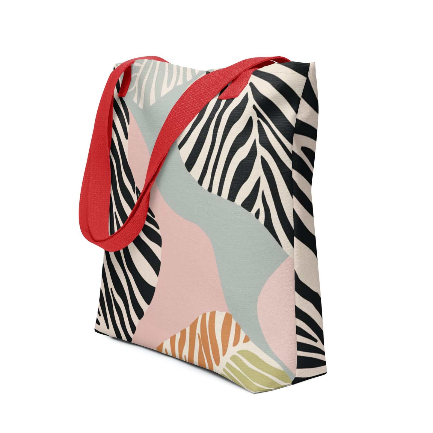 Zebra print tote bag with red handles, in a colourful and avant garde zebra inspired design, shown in side view. Dimension 15x15 inches. White background.