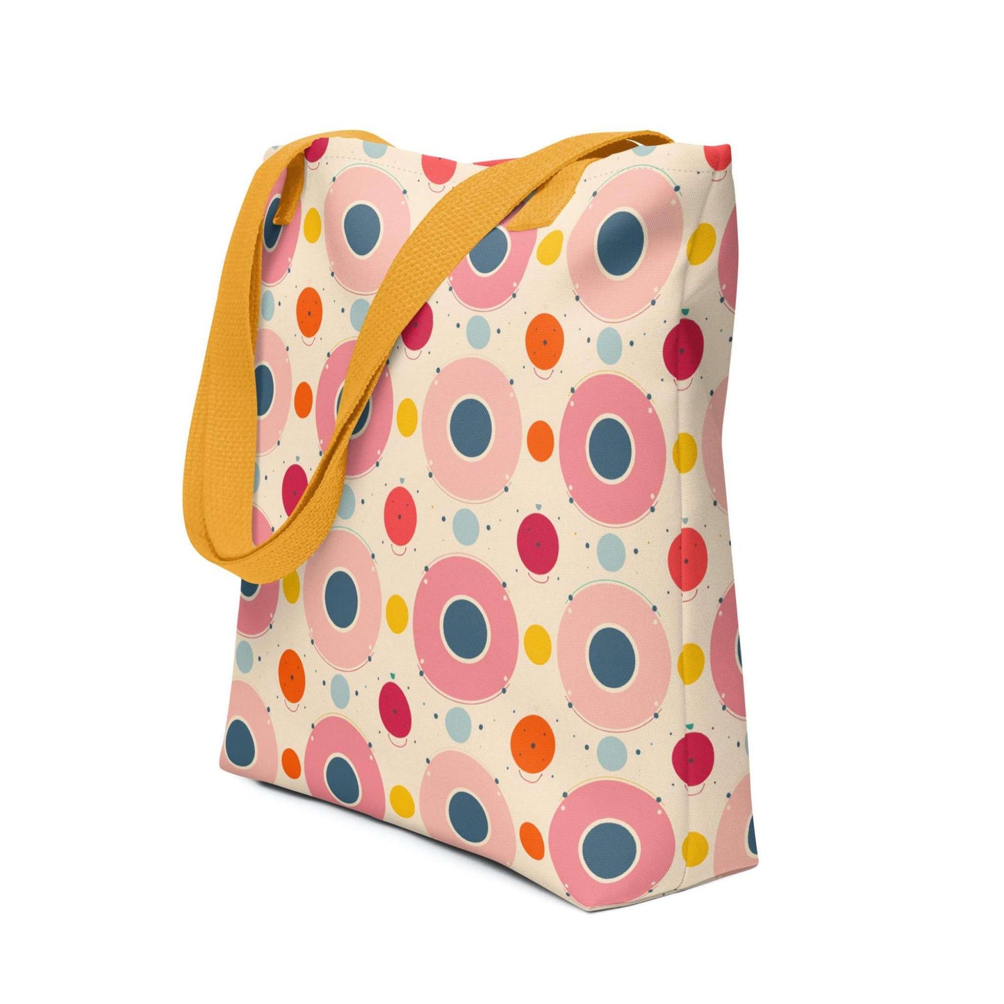 Artsy tote bag with yellow handles, which features an artsy design of pastel candy pops of color in a beige background, shown in side view. Dimension 15x15 inches. White background.