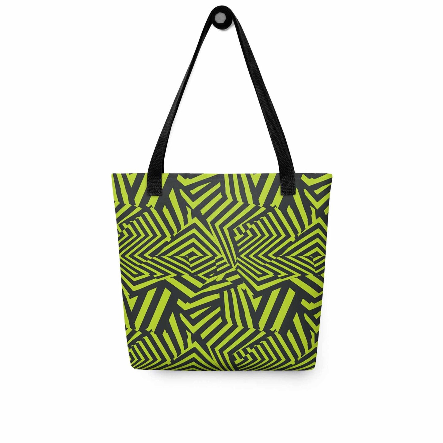 An avant garde tote bag with black handles, which features bold black and green op art illusion, hanging on a white wall. Size is 15x15 inch.