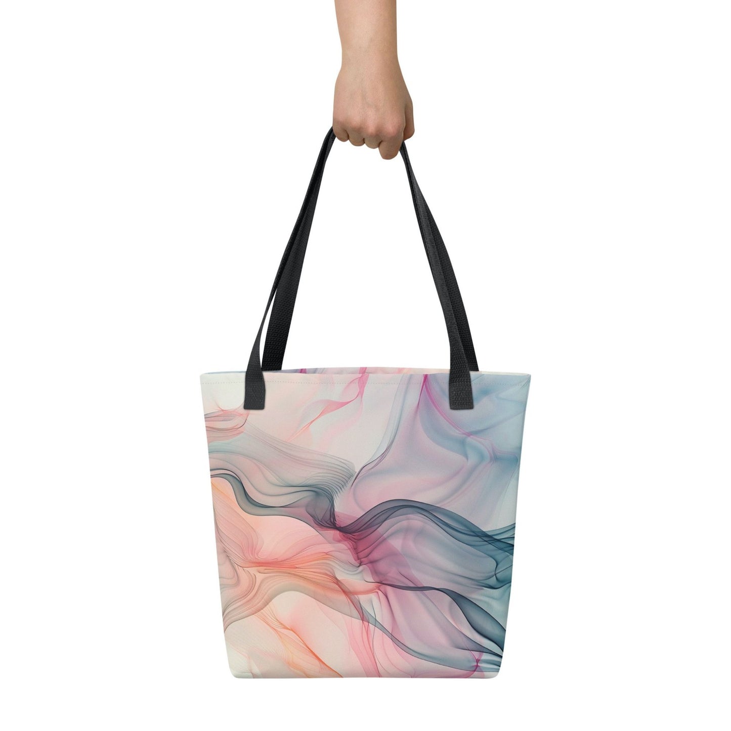 Fashion ladies tote bag with black handles, which design features an abstract art of artistic wavy bluish and pastel lines, held in a hand against a white wall. Dimension 15x15 inches.