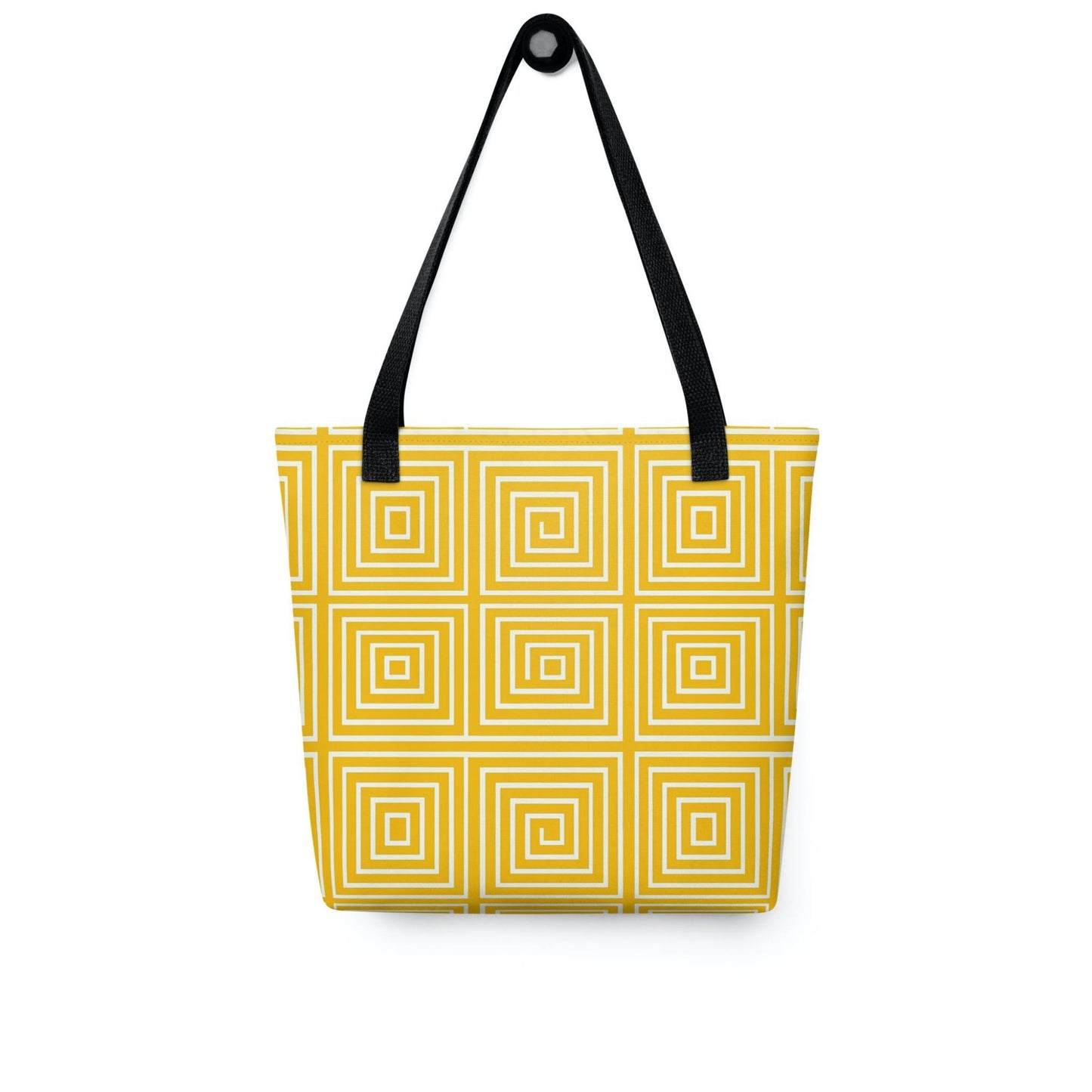 Yellow op art tote bag with black handles, with mesmerizing square-patterned op art illusion in a calming yellow, hanging on a white wall. Dimenion 15x15 inches.