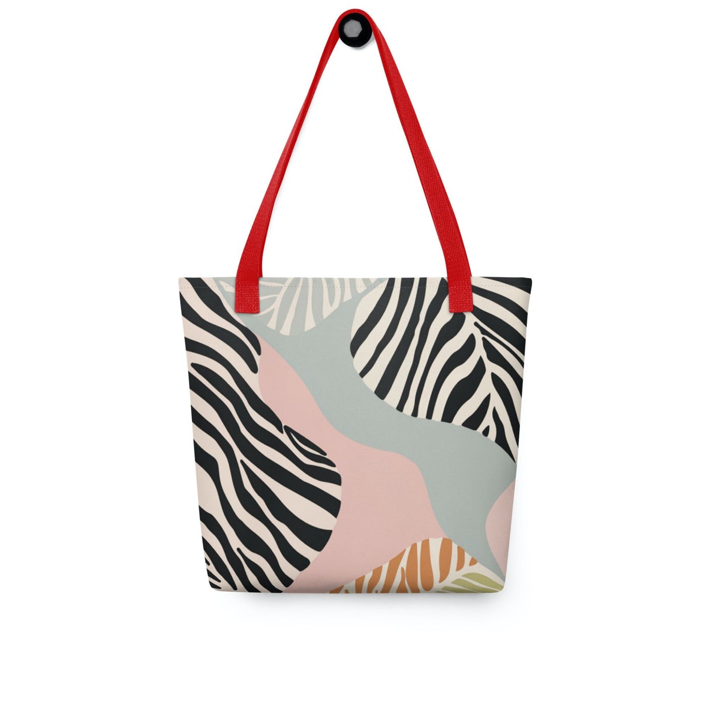 Zebra print tote bag with red handles, in a colourful and avant garde zebra inspired design, hanging on a white wall. Dimension 15x15 inches.