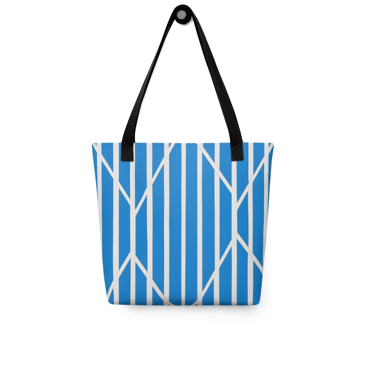 A tote bag with a striking design of blue and white striped tote which is a piece of kinetic art, hanging on a wall. The ordered rhythm of vertical stripes is dramatically intersected by bold, angular lines, creating a beautiful tension and dynamic focal point. Dimensions 15x15 inches. Front view. White background.  