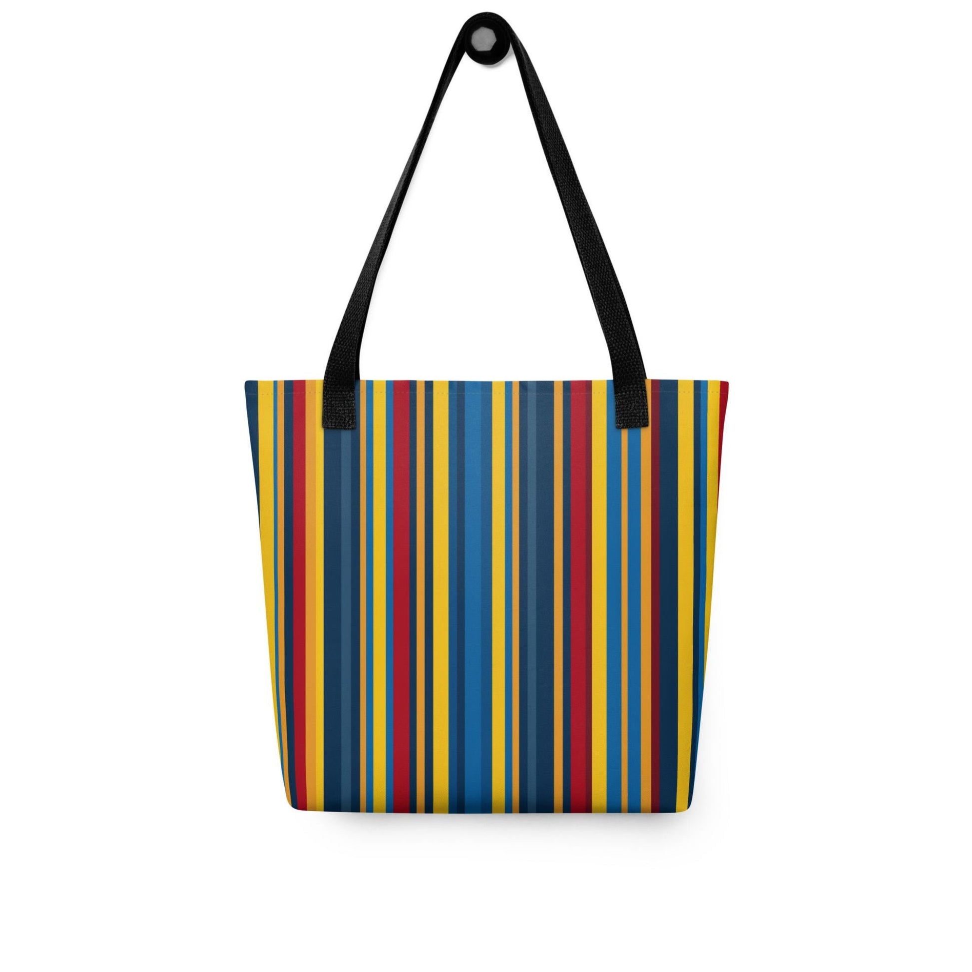 A blue striped tote bag which features a stunning geometric pattern in rich navy, glamorous gold, and deep burgundy, capturing the sophistication of high-end design. Black handles. Dimension 15x15 Inch polyester tote. Front view. White background. 