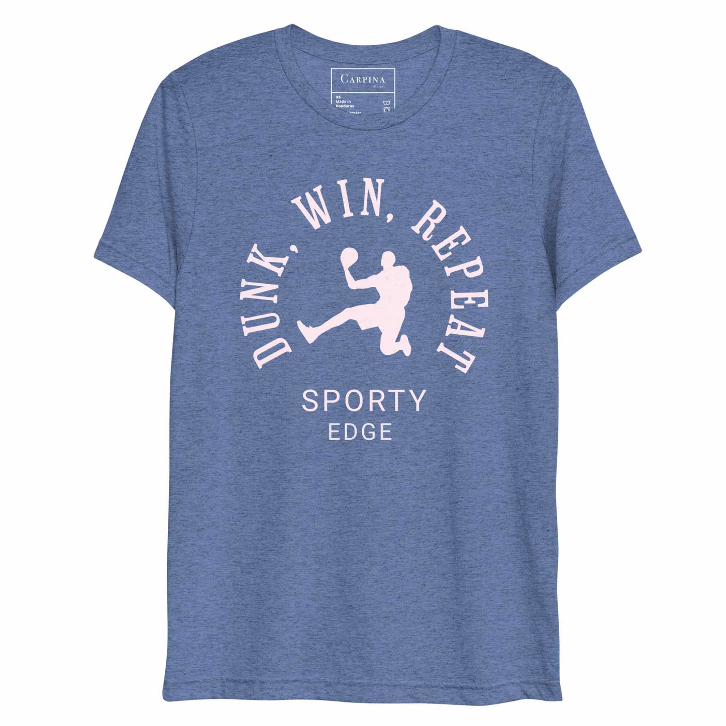 Flatlay of a basketball graphic tshirt in blue color.he unisex triblend tshirt features the words "Dunk, Win, Repeat and Sporty Edge" circling a graphic of an active basketball player. White background.