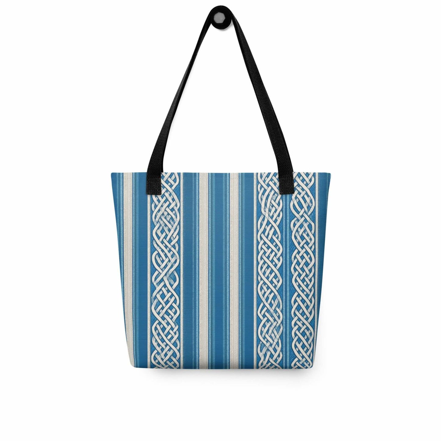 A sophisticated celtic tote bag which features intricate white knotwork columns flowing over deep marine blue and textured cream stripes. Front view. White background.