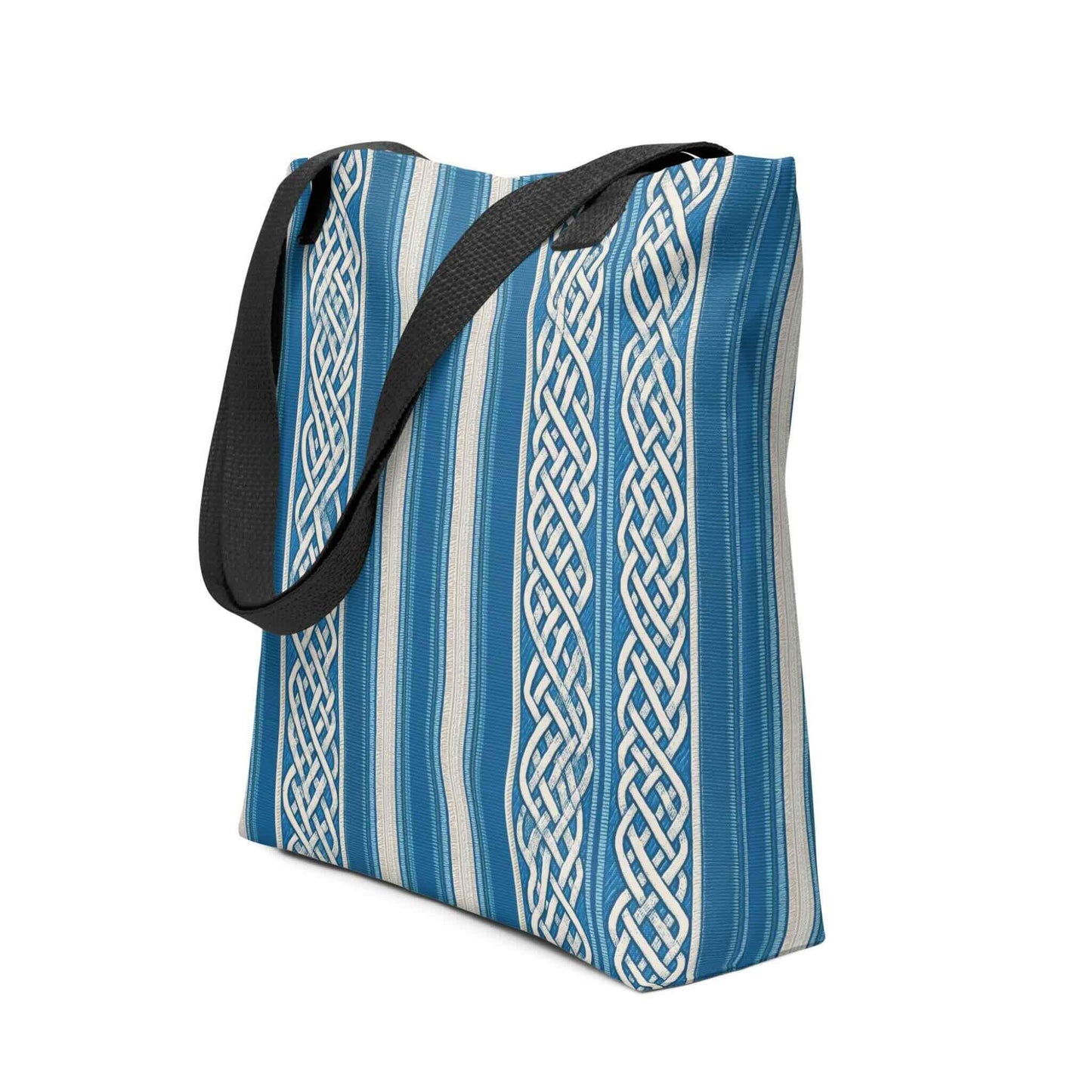 A sophisticated celtic tote bag which features intricate white knotwork columns flowing over deep marine blue and textured cream stripes. Side view. White background.