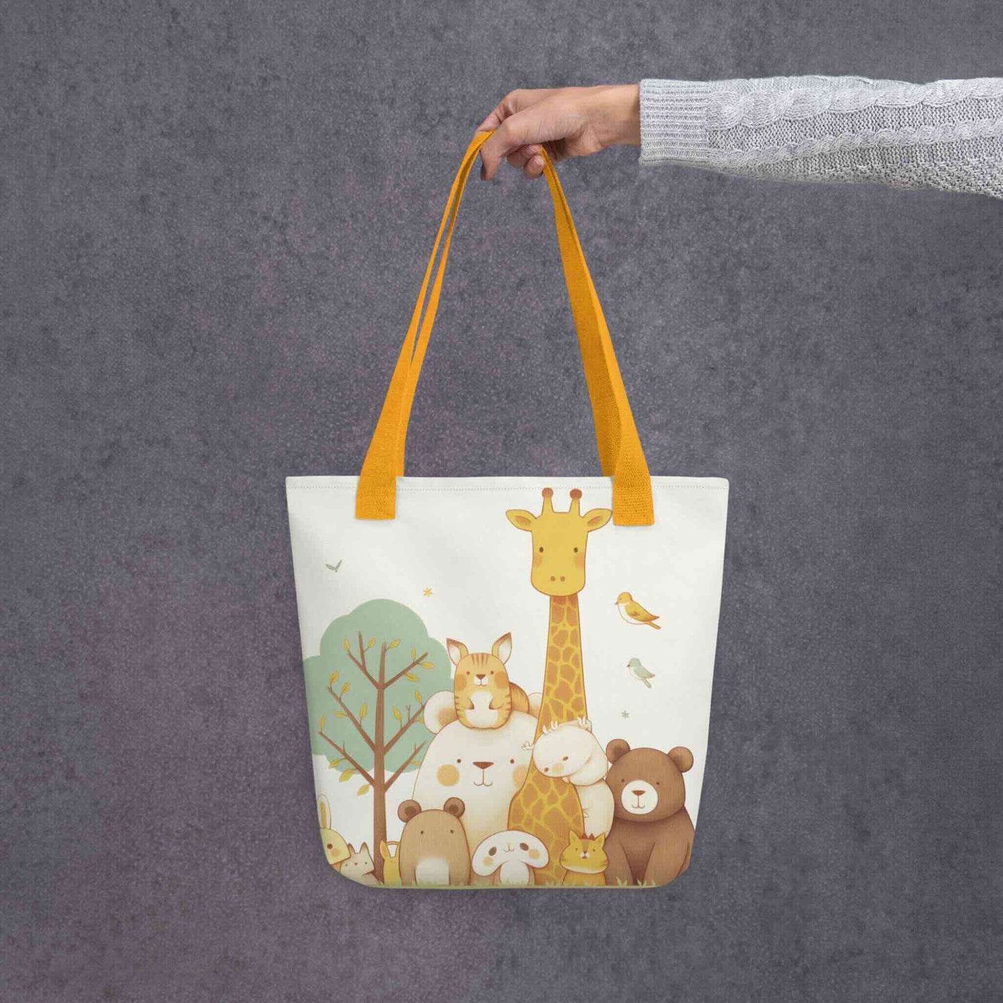 Cute tote bag featuring a stylish
gathering of our sweet animal villagers, with yellow handles, held in a hand against a grey background.