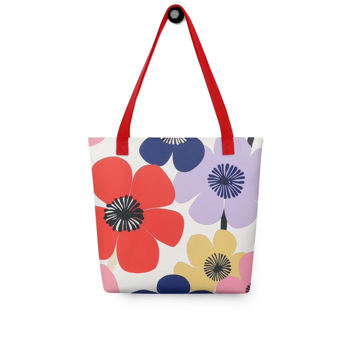 A Floral Tote Bag, with red handles, which features a stunning, abstract bloom pattern that brings warmth and joy wherever you go.The bag hangs on a wall. White background.