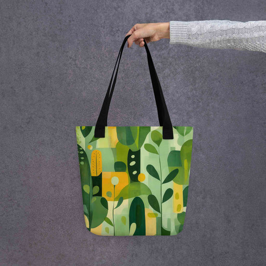 Carry nature's beauty with our "VERDURE" abstract tote bag. This spacious 15x15 inch canvas features soothing earth tones and organic shapes, a modern celebration of the natural world. Shop our unique abstract tote bags today and add a touch of calm sophistication to your style. Black handle. Grey background.