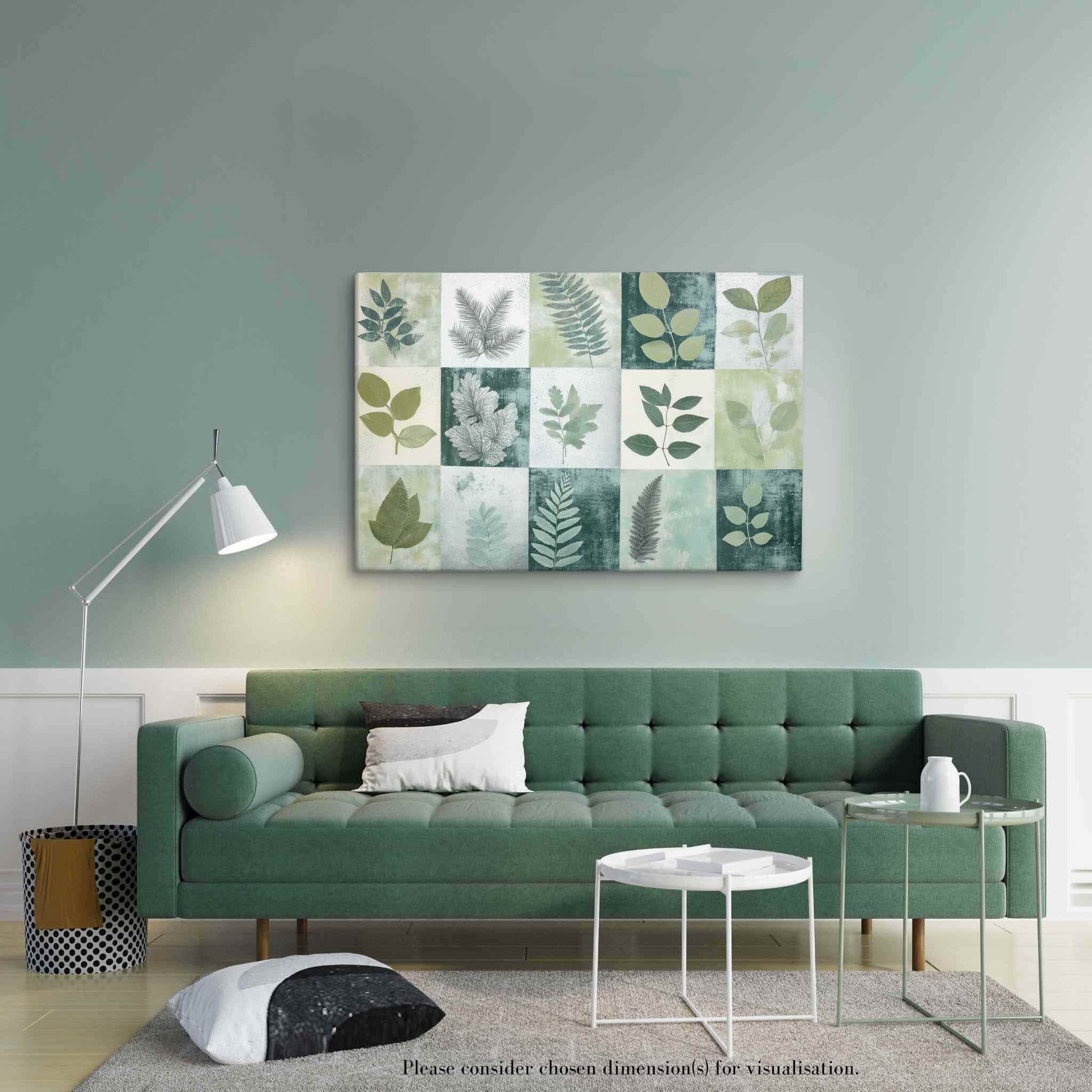 Discover "PHOTOTYPE17," a landscape canvas print showcasing a mesmerizing green botanical cyanotype collage. This unique artwork features an artistic grid of striking leaves. Experience the serene yet scientific beauty of this modern herbarium-inspired piece. Perfect for adding a touch of natural sophistication to your space. The canvas print hangs on a wall over a green sofa in a modern living room with white coffee table and white lamp.