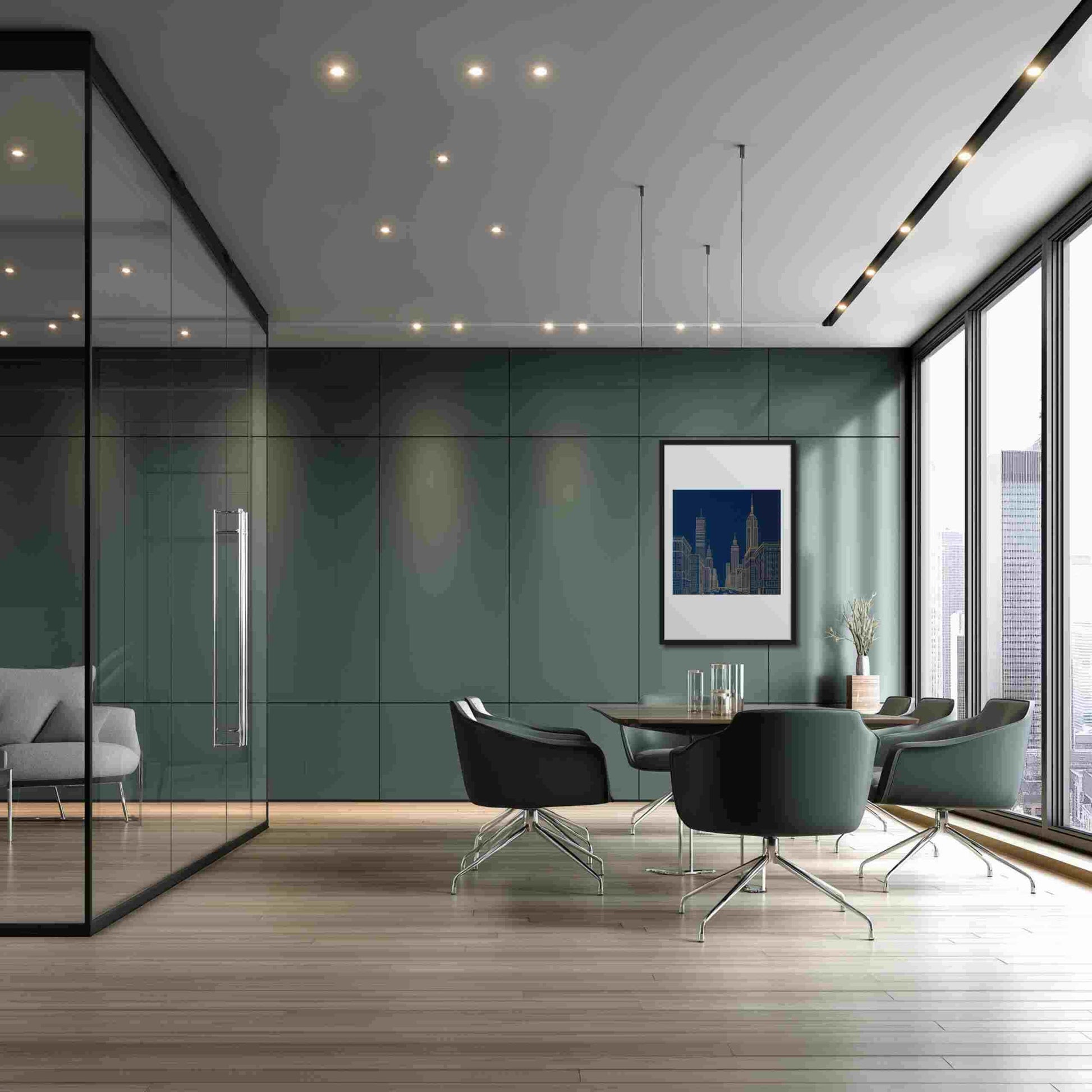 New York skyline line drawing in bold gold lines against a deep architectural blue, in a framed poster with mat, hanging on a wall in a seating area of a sleek modern office.