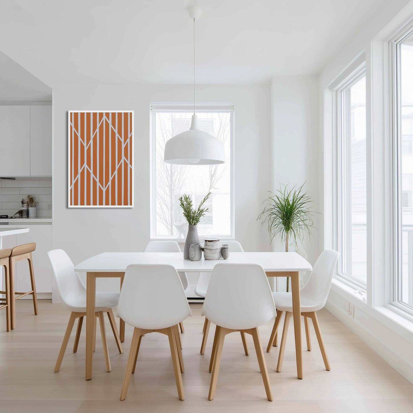 Illustration 2 of a vibrant piece of orange and white abstract art in framed poster. The rich, autumnal stripes are dramatically framed and intersected by crisp, white geometric lines. The poster hangs in a modern white Scandinavian dining room.