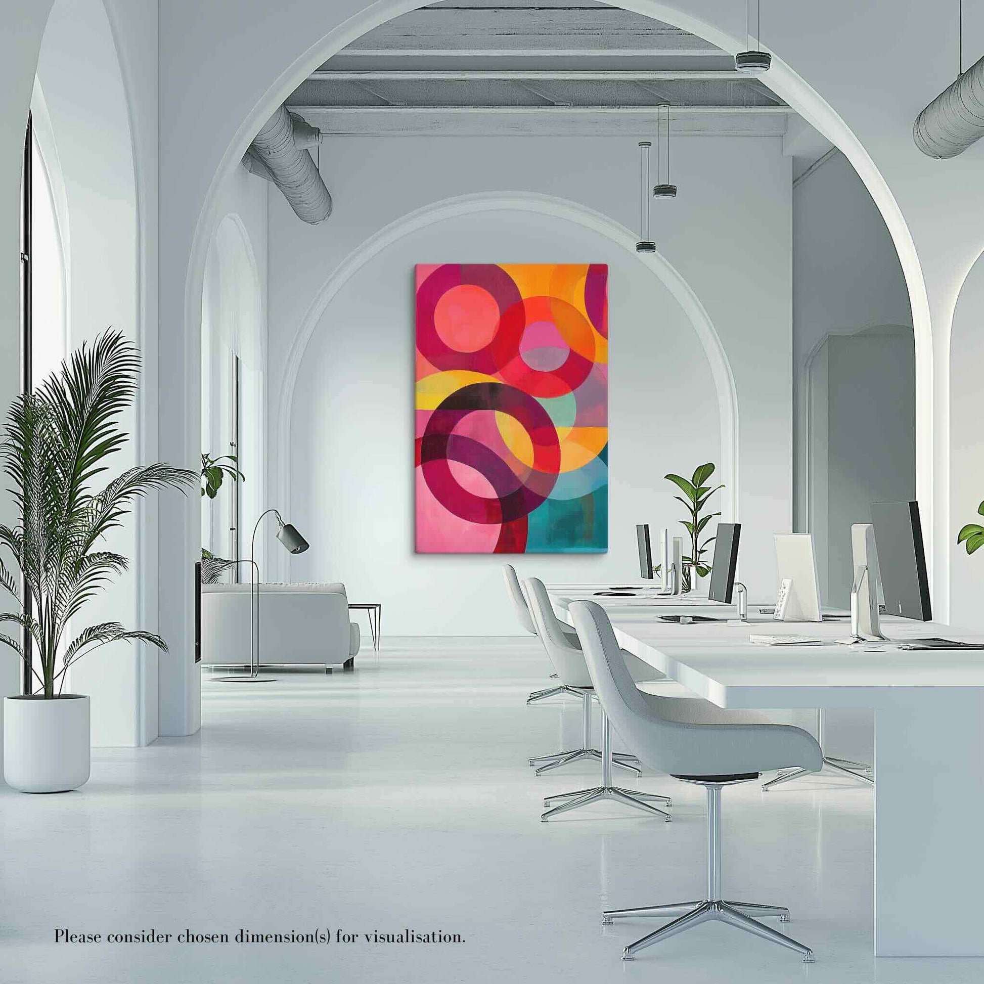 A captivating circular abstract painting featuring vivid reds, pinks, oranges, teal and gold, hung on a wall in a modern white office. A beautiful arch frames the wall art.