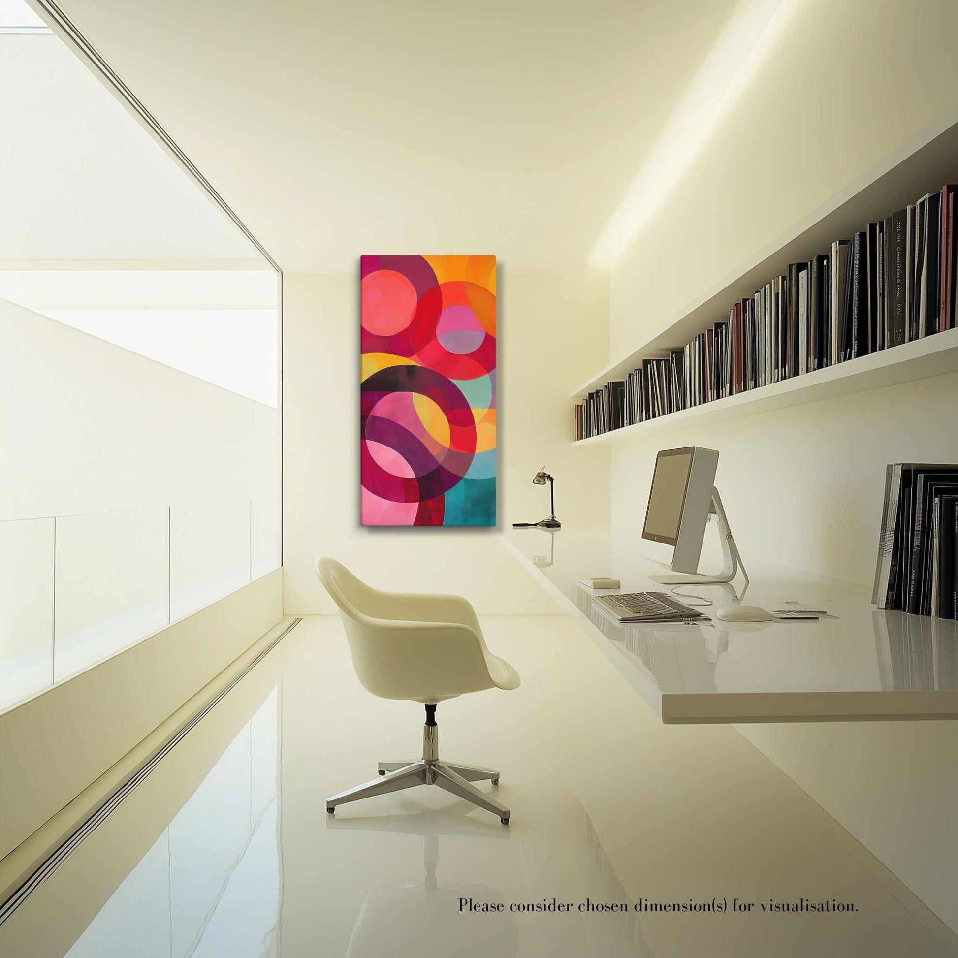 A captivating circular abstract painting featuring vivid reds, pinks, oranges, teal and gold, hung on a cream wall at the end of a long modern office facing the camera. The office is awash with warm sunlight coming from the windows on the left.