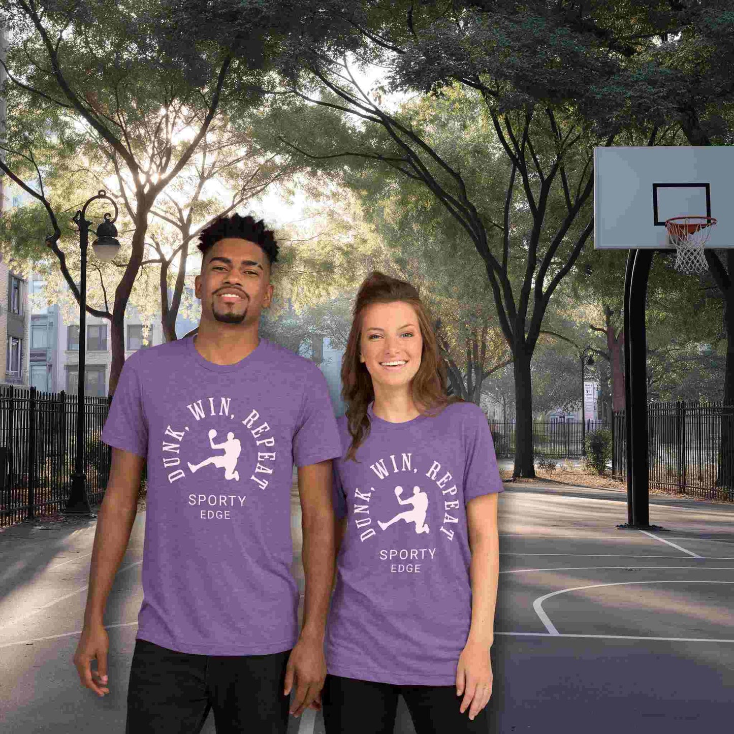 Basketball graphic tshirts in purple color won by a couple standing on a basketball court. The unisex triblend tshirt features the words "Dunk, Win, Repeat and Sporty Edge" circling a graphic of an active basketball player.