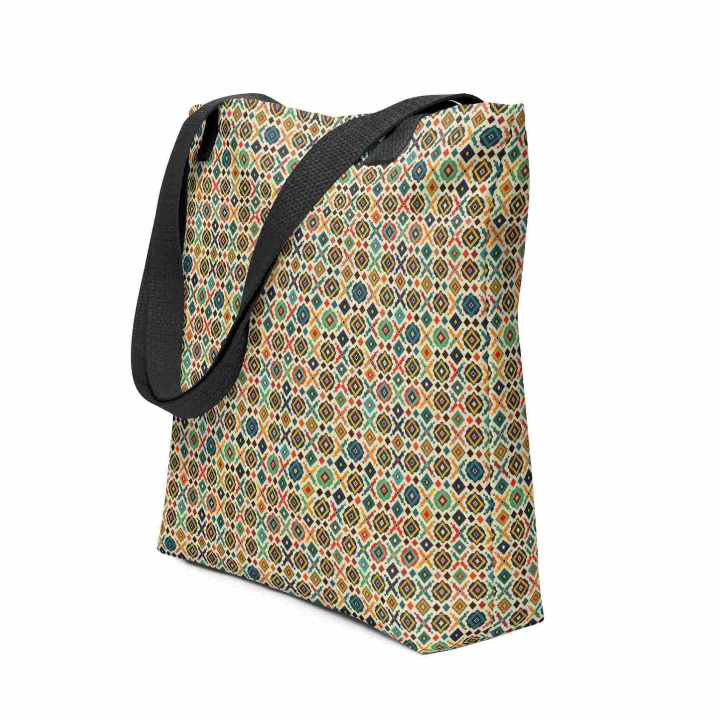 Side view of a 15x15 inch tote bag with black handles, which design is an Argentine inspired diamond pattern. White background.