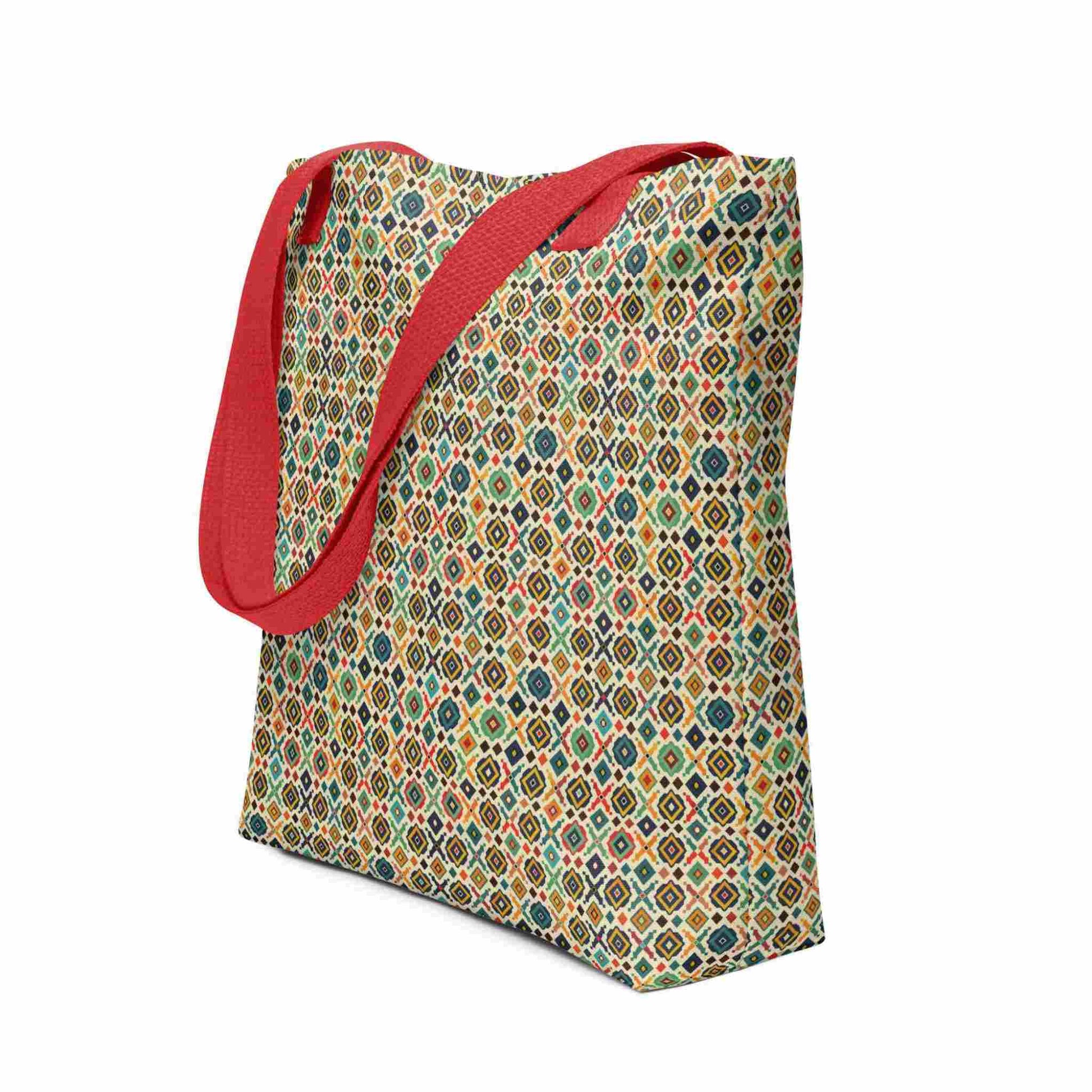 Side view of a 15x15 inch tote bag with red handles, which design is an Argentine inspired diamond pattern. White background.