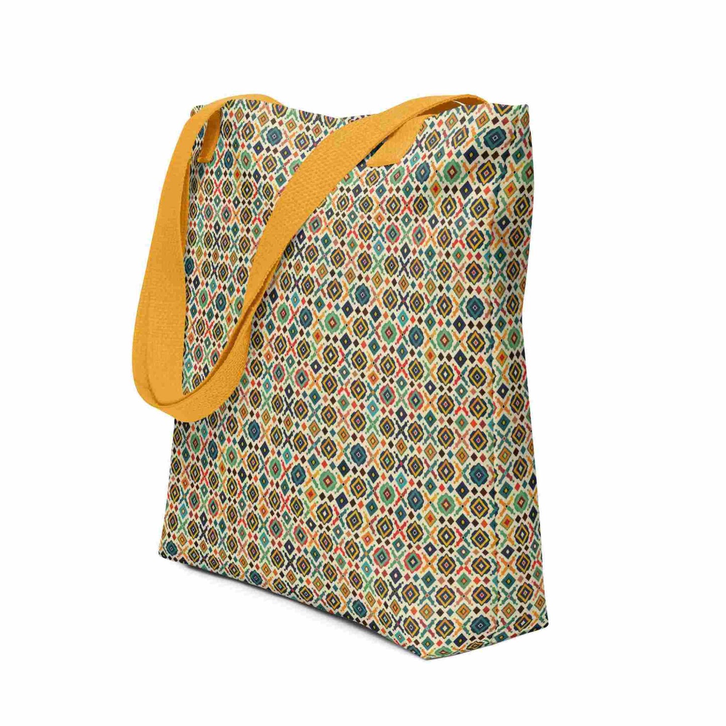 Side view of a 15x15 inch tote bag with yellow handles, which design is an Argentine inspired diamond pattern. White background.