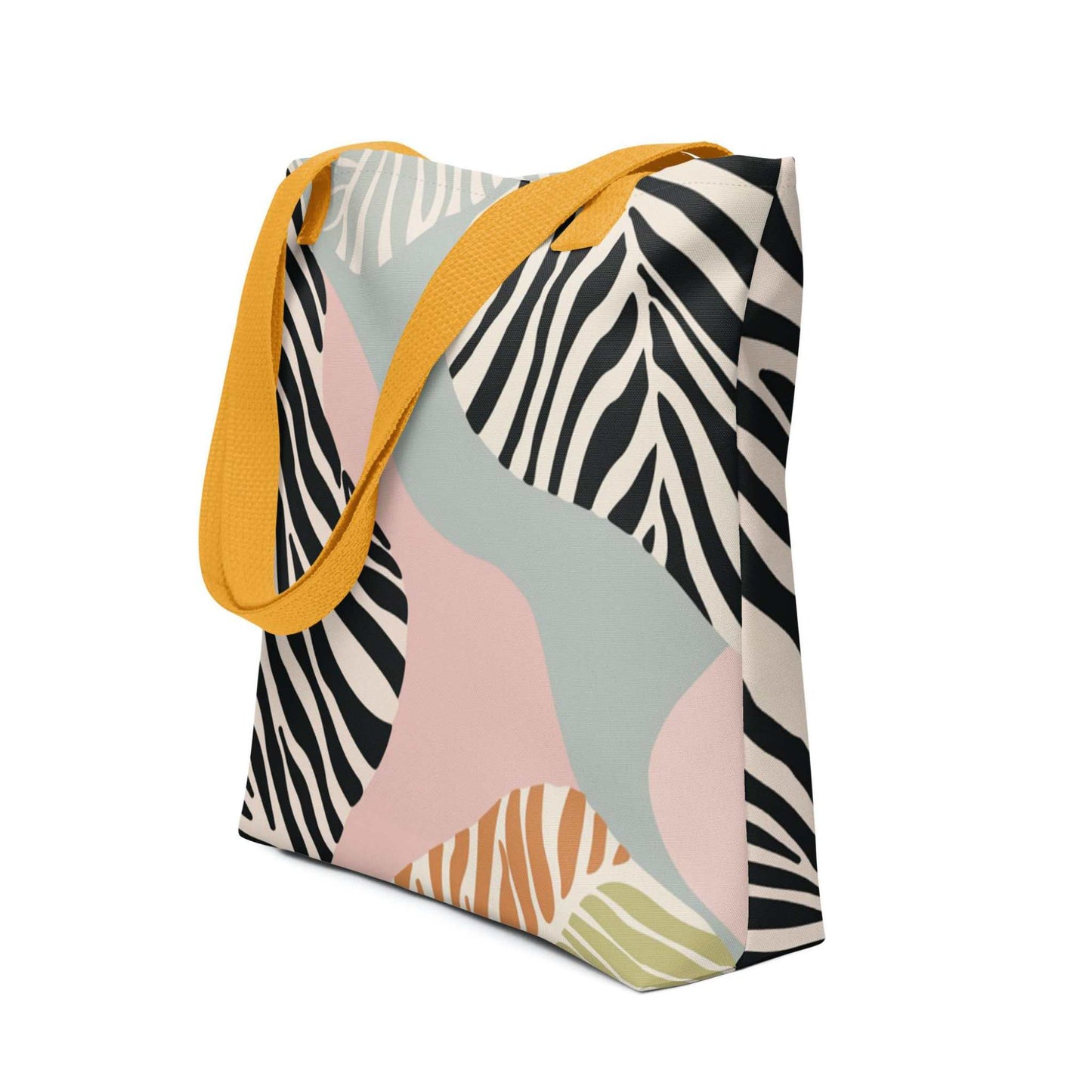 Side view of a 15x15 inch tote bag with yellow handles, in a colourful Zebra inspired design. White background.