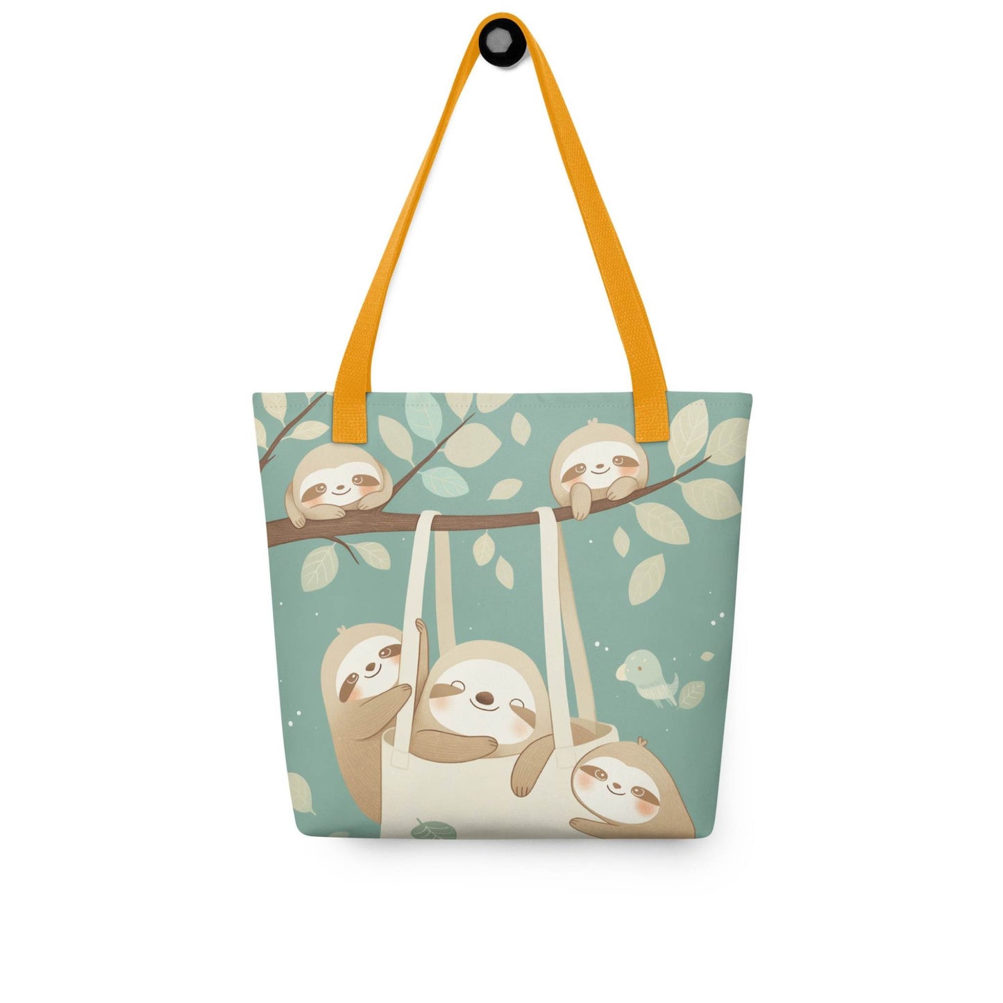 The cutest sloth tote bag you'll ever carry! This charming, sophisticated design captures the tranquility of the forest, with yellow shoulder handles, hanging on a wall. White background.