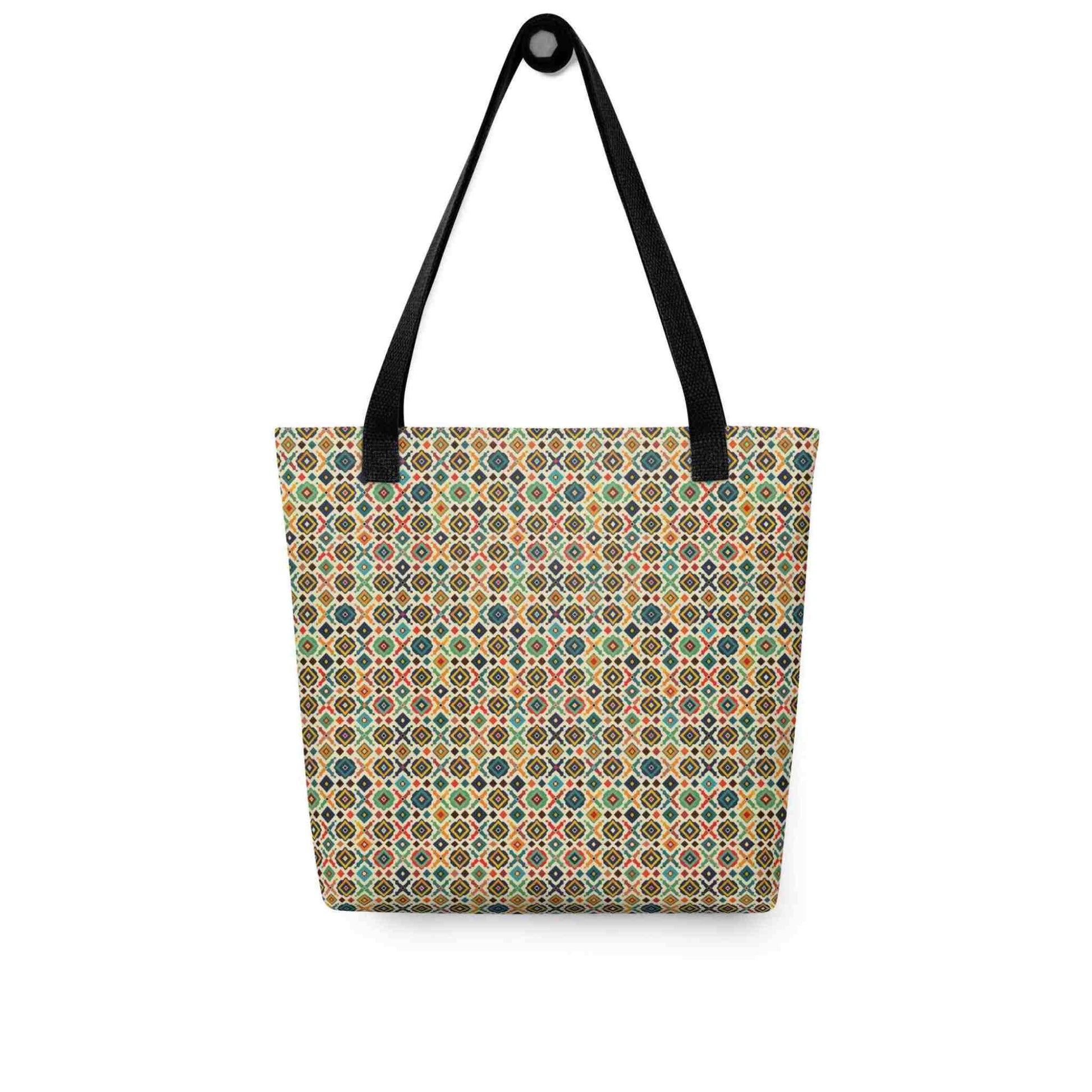 Rustic tote bag with black handles, which design is an Argentinian inspired diamond pattern, hanging on a white wall. Dimension 1515 inches.