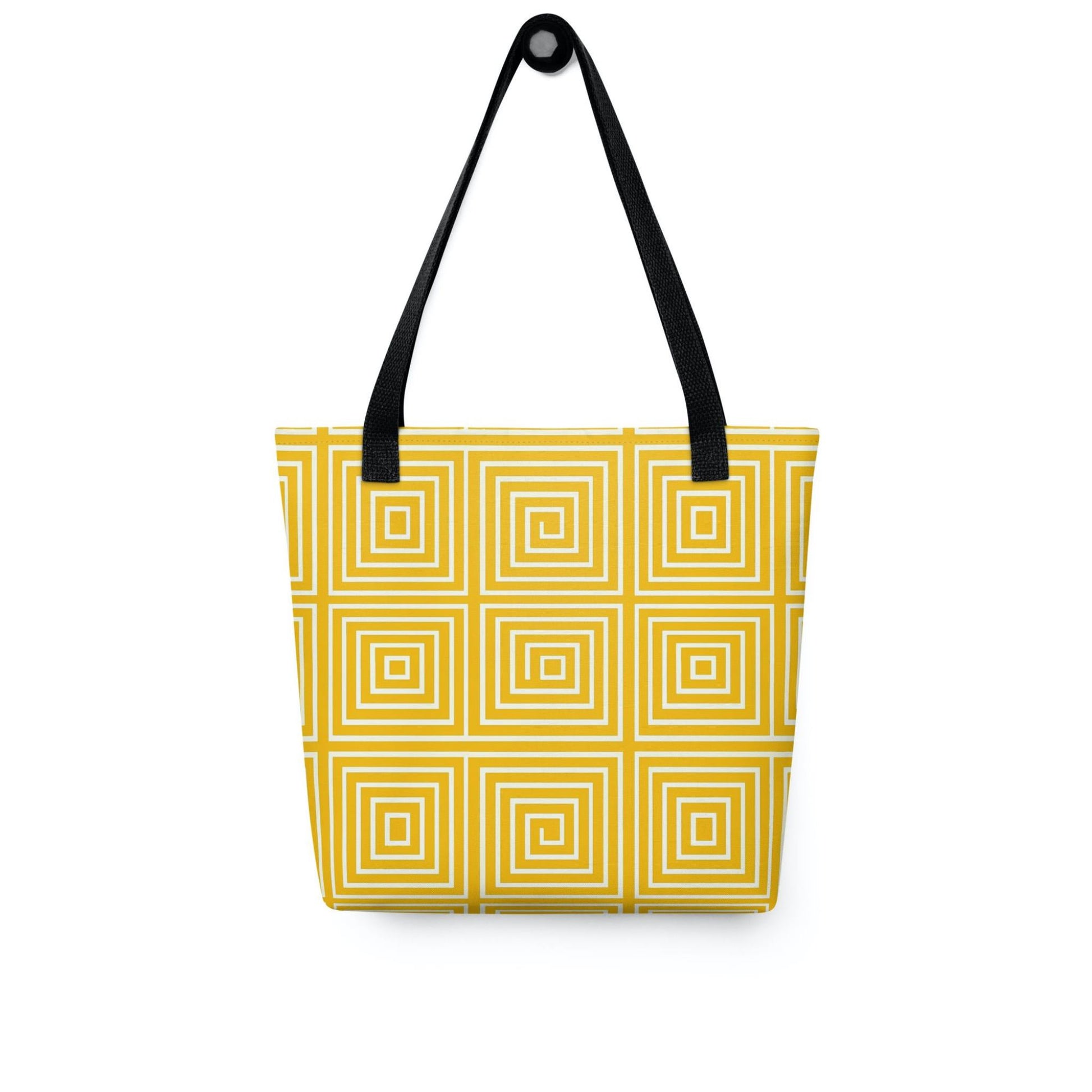 Yellow op art tote bag with black handles, with mesmerizing square-patterned op art illusion in a calming yellow, hanging on a white wall. Dimenion 15x15 inches.